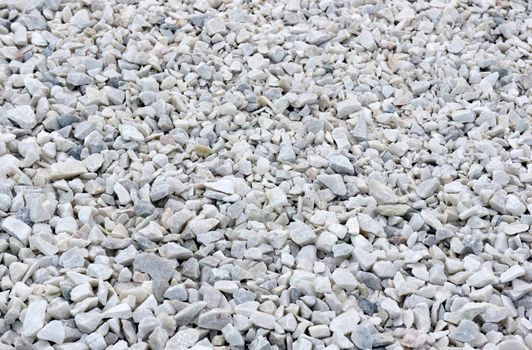 White crushed marble stones background.
