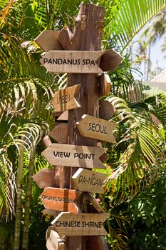 Signpost with arrows on the tropical beach