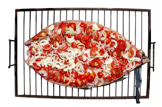 Preparing fish for grilling on the grill. Isolated on white. Clipping path included.