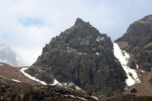 Mountains in the alps with clouds 