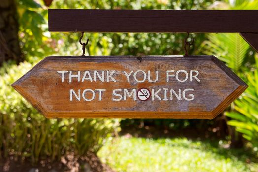 Close up of wooden sign - Thank you for not smoking