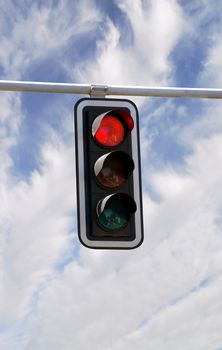 Red traffic lights against blue sky backgrounds with clipping path