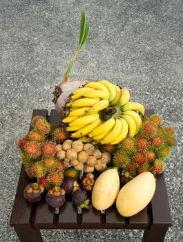 Tropical sweet delicious fruits at street market in Thailand
