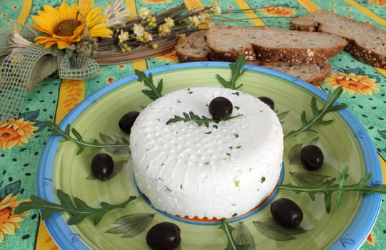 Fresh cheese with black olives