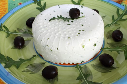 Fresh cheese with black olives