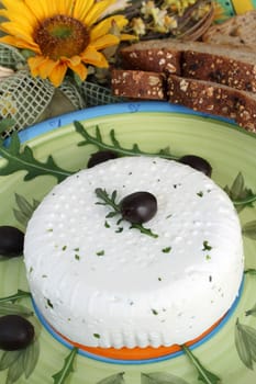 Fresh cheese with black olives