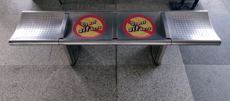 Social distancing on bench because of corona virus pandemic, 2020 in Public spaces at Indira Gandhi International Airport in Delhi, India