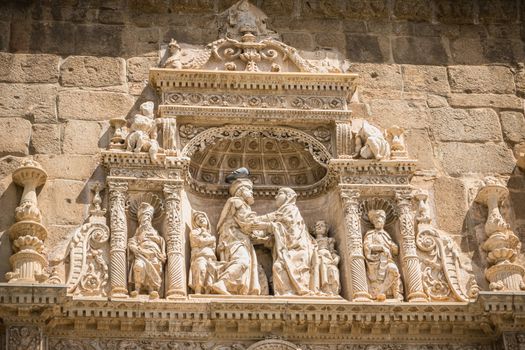 Toledo, Spain - April 28, 2018: Architectural detail of the museum Santa Cruz de Toledo on a spring day. Plateresque building of the sixteenth century