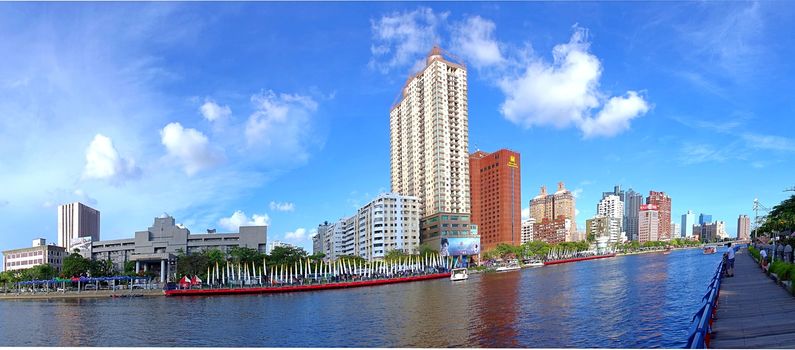 KAOHSIUNG, TAIWAN -- JUNE 14, 2015: A panoramic view of the Love River in downtown Kaohsiung city on a clear summer day.