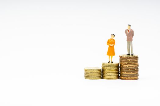 Miniature people standing on stacking coins with white background. Business and Lifestyle concepts.