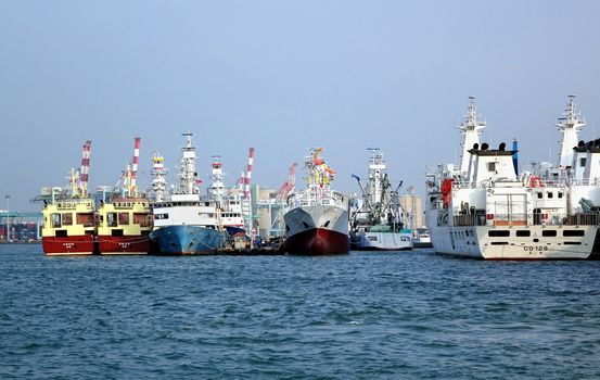 KAOHSIUNG, TAIWAN -- OCTOBER 11, 2014: View of a local shipyard at Kaohsiung port where small and medium sized vessels are being built.