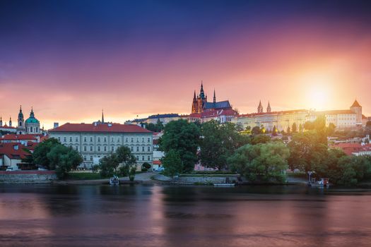 Prague old town including Prague castle in the background, one of the most famous landmarks of Prague at sunset with dramatic sky.