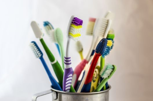 close up image of color full old toothbrush