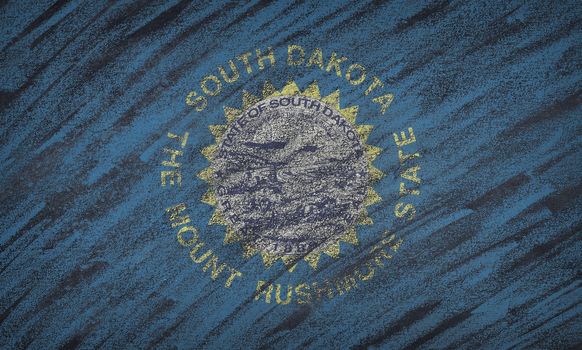 Close-up of national South Dakota state flag painted with colored chalk on a blackboard.