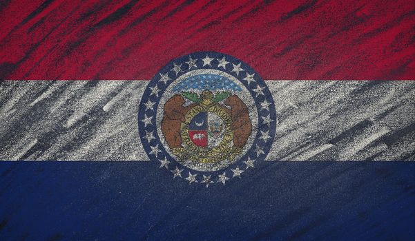 Close-up of national Missouri state flag painted with colored chalk on a blackboard.