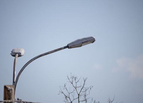 city street light in day, blue sky