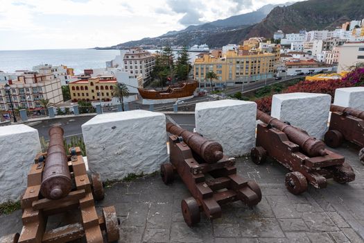 Cannons look out from the Castle of the Virgin. Santa Cruz - capital city of the island La Palma, Canary Islands, Spain.