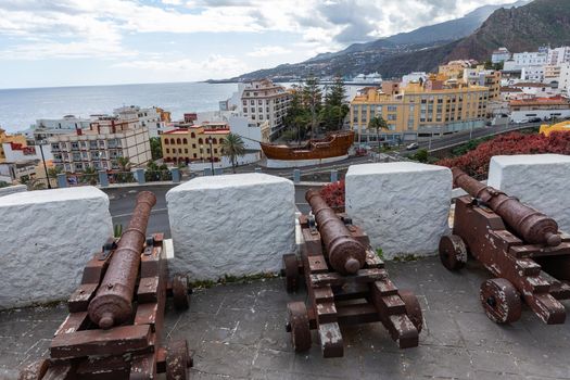 Cannons look out from the Castle of the Virgin. Santa Cruz - capital city of the island La Palma, Canary Islands, Spain.