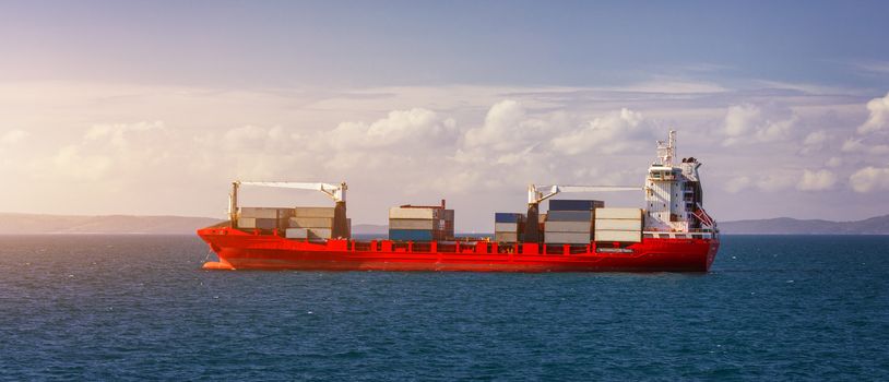 Logistics and transportation of International Container Cargo ship in the sea. International Container Cargo ship in the ocean, Freight Transportation, Shipping, Nautical Vessel.