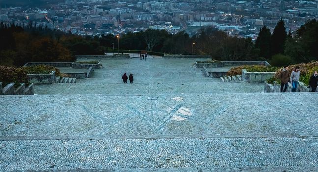 Braga, Portugal - December 1, 2018: People walk in the sanctuary of Our Lady of Sameiro near Braga at dusk