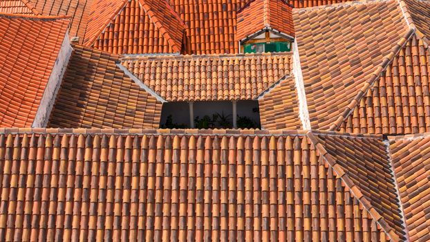 Trogir in Croatia, town panoramic view with red roof tiles, Croatian tourist destination. Trogir town sea front view, Croatia. Roofs of Trogir in Croatia.