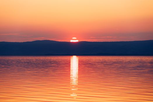 Beautiful sunset or sunrise above the sea. Tropical sunset or sunrise over sea. Colourful sunset or sunrise over water.