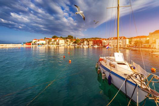 Fishing boat anchoring in beautiful Sutivan port, Brac island, Croatia. Sutivan on Island Brac in Croatia. Made of well known white limestone. Port with fishing boats. Sutivan, Brac, Croatia.