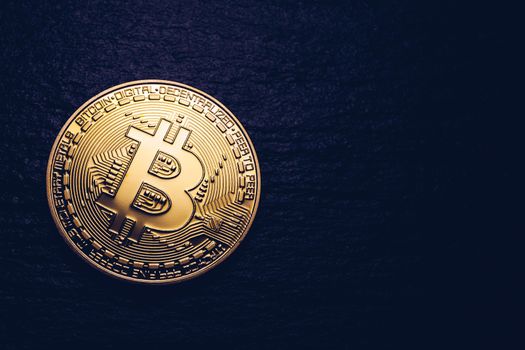 Crypto currency golden coin with bitcoin symbol on isolated on black background. Bitcoin Coin on black background. Bitcoin cryptocurrency.  Cryptocurrency Coin Concept.