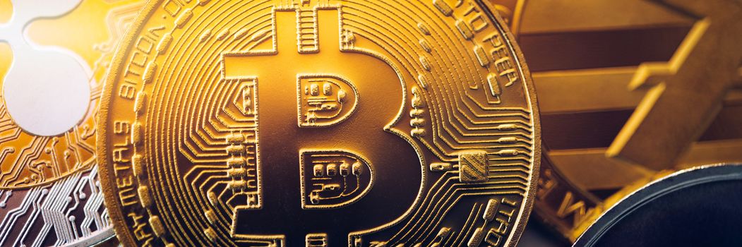 Stack of cryptocurrencies with a golden bitcoin. Bitcoin as most important cryptocurrency concept. Bitcoin. Physical bit coin. Digital currency. Cryptocurrency. Golden coin with bitcoin