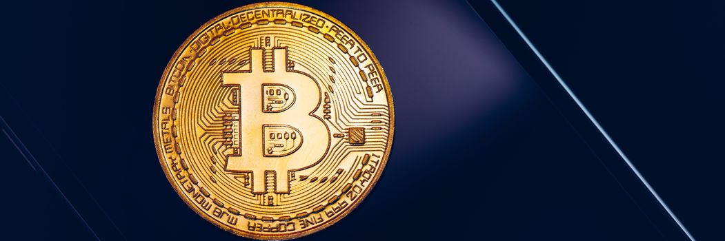 Bitcoin symbol over mobile screen, minimalist approach. Bitcoin on stock market. New digital money. Golden Bitcoin over smartphone display.