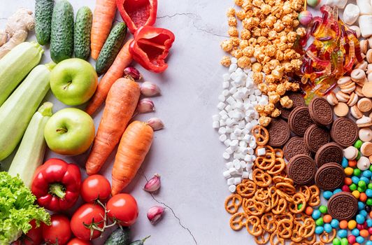 Healthy and unhealthy food concept. Fruits and vegetables vs sweets top view flat lay