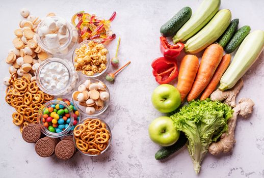 Healthy and unhealthy food concept. Fruits and vegetables vs sweets top view flat lay