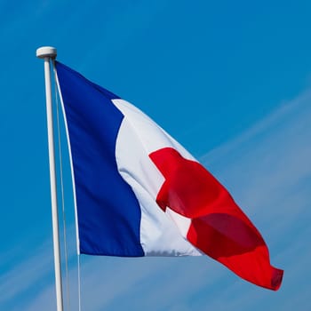 the French national flag of France, Europe over blue sky