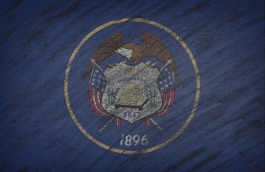 Close-up of national Utah state flag painted with colored chalk on a blackboard.