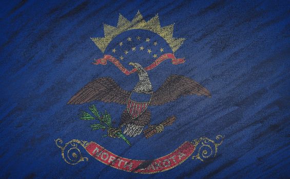 Close-up of national North Dakota state flag painted with colored chalk on a blackboard.