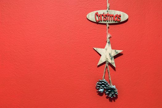 Christmas with hanging decorations on red background. Christmas red background with christmas decoration.