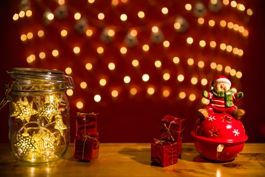 Christmas fairy lights in a mason jar, glowing in the dark, fairy lights in mason jar with selective focus, glitter overlay 