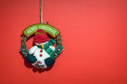 Christmas with hanging decorations on red background. Christmas red background with christmas decoration.