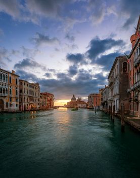 Grand Canal at sunrise in Venice, Italy. Sunrise view of Venice Grand Canal. Architecture and landmarks of Venice. Venice postcard