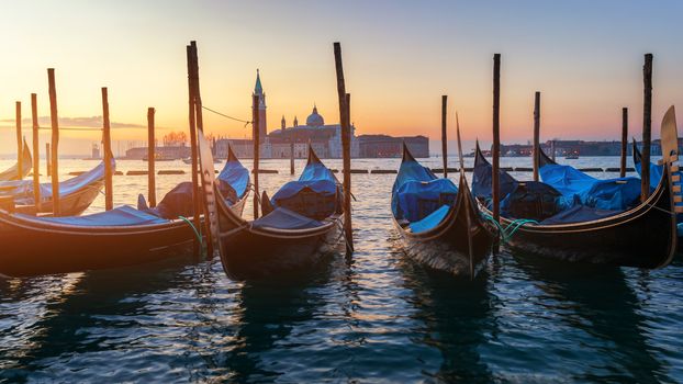 Sunrise in San Marco square, Venice, Italy. Venice Grand Canal. Architecture and landmarks of Venice. Venice postcard with Venice gondolas
