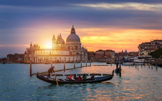 Canal with gondolas in Venice, Italy. Architecture and landmarks of Venice. Venice postcard with Venice gondolas.