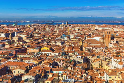 Venice panoramic aerial view with red roofs, Veneto, Italy. Aerial view of the Venice city, Italy. Venice is a popular tourist destination of Europe. Venice, Italy.