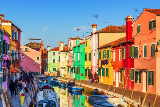 Lovely house facade and colorful walls in Burano, Venice. Burano island canal, colorful houses and boats, Venice landmark, Italy. Europe