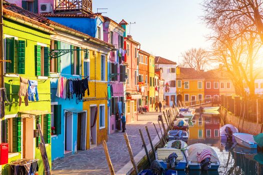 Lovely house facade and colorful walls in Burano, Venice. Burano island canal, colorful houses and boats, Venice landmark, Italy. Europe