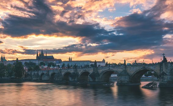 View of Prague Castle and Charles Bridge at sunset. Czechia