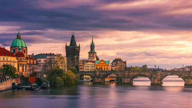 Scenic spring sunset aerial view of the Prague Old Town pier architecture and Charles Bridge over Vltava river in Prague, Czech Republic