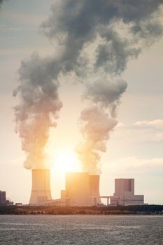 Nuclear power plant on the coast. Ecology disaster concept. 