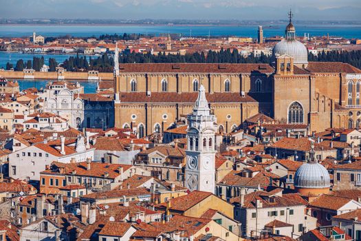 Venice panoramic aerial view with red roofs, Veneto, Italy. Aerial view of the Venice city, Italy. Venice is a popular tourist destination of Europe. Venice, Italy.