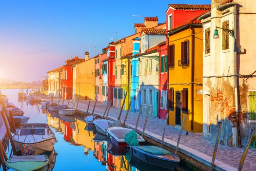 Laundry hanging out of typical houses of Burano Island, Venice, Italy. Multicolored buildings and laundry drying on the street in Burano, Venice, Italy