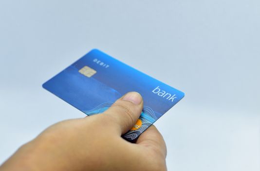 Close up of hand using credit card to pay payment